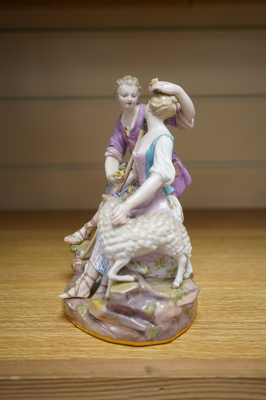 A 19th century Meissen shepherd and shepherdess group, incised to base ‘A41’, 18cm. Condition - fair, chip to base and restoration